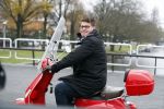 Amsterdam 21 november 2017 
Martijn Krabbe op zijn rode vespa scooter in Amsterdam zuid
