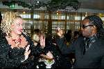 Scheveningen 15 december 2003
Brunch in het Holland casino in Scheveningen.
Regilio Tuur met gsm en pardenstaart met Karin Bloemen