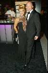 Amsterdam 10 december 2003
Miljonairsbeurs in de RAI Amsterdam. 
Connie Breukhoven met sexy jurk en Mart Visser