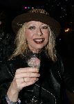 de Kwakel 23 december 2005
Kerstborrel Gerard Joling.
Bonnie st Claire met  hoed en champagne