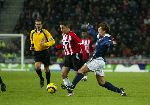 Eindhoven, 17 December 2005 Kompetitiewedstrijd PSV-Willem II ,  eindstand 4-1
Ismail Aissati in duel Martijn Reuser
@Foto: Junior Smulders