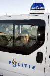 Lelystad14 december 2005
jan Smit in politieauto bij vliegveld Lelystad.