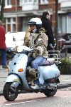 Amsterdam 21 januari 2006
Josefine v Asdonk met hond en gsm op vespa scooter