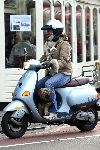 Amsterdam 21 januari 2006
Josefine v Asdonk met hond en gsm op vespa scooter