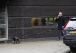 Amsterdam 31 januari 2018 
Tom Egbers bellend op straat met zijn hond