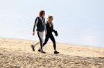 Schoorl 2 januari 2020Sonja Bakker en barry v Suijdam met hun hond op het strand.