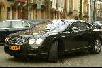 Amsterdam 22 februari 2004
Bram Moszkowicz in zijn nieuwe Bentley coupe.