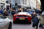 Amsterdam 8 januari 2016
Fans van auto's maken foto;s van een nieuwe ferrari op de pc hooftstraat