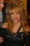 Amsterdam 15 september 2002
Modeshow Paul Schulten in Okura
Adam Curry en Patricia Paay