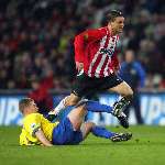 Eindhoven, 20 Januari 2006
Kompetitiewedstrijd Seizoen 2005/2006 
PSV-RKC Waalwijk eindstand 2-0
Jason Culina ontwijkt een tackle
© Foto Bart Bel