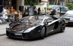 Amsterdam/Amstelveen 6 juli 2012
Badr Hari en Estelle Cruijff op terras en op weg naar reisburo in Lamborghini.
Peter Smulders bv