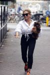 Amsterdam 10 juli 2021
Connie Witteman met haar hondje ,dochter Constanza en kleinkinderen in 2 biro karretjes in Amsterdam zuid