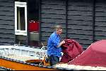 Amsterdam 8juli 2003
Hans v d Togt met zijn hondjes in zijn sloep voor zijn woonboot