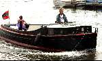 Amsterdam  8 juli 2003
Jeroen Pauw  en Daphne Bunskoek op boot