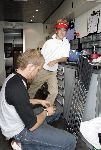 Halfweg, 26 Juli 2005 Golfclub Houtrak
Demonstratie en clubfitting van TaylorMade
Op de foto Junior Smulders spelend voor golfclub Best Hcp 2.1
met de clubfitter van TaylorMade die zijn nieuwe clubs aan het maken is