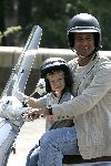 Amsterdam 13 juli 2005
Ruud Gullit met zijn zoon Maxim op vespa scooter