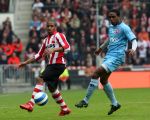 Eindhoven, 13 April 2008 Kampioenswedstrijd PSV-FC Twente, eindstand 1-1 Seizoen 2007/2008. PSV daardoor nog niet kampioen.
Edson Braafheid in duel met Jefferson Farfan