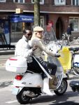 Amsterdam 21 april 2008
Regilio Tuur met vriendin Josh op vespa scooter met been in het gips en krukken.
Peter Smulders bv