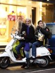 Amsterdam 2 december 2008
Angela v Hulten met Quincy en Justin  Kluivert op vespa scooter.
Peter Smulders bv