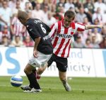 Eindhoven, 23 September 2007 Seizoen 2007/2008 Kompetitewedstrijd PSV-Feyenoord, eindstand 4-0
Danko Lazovic in duel met Theo Lucius