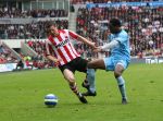 Eindhoven, 13 April 2008 Kampioenswedstrijd PSV-FC Twente, eindstand 1-1 Seizoen 2007/2008. PSV daardoor nog niet kampioen.
Jason Culina in duel met Edson Braafheid