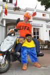 Eindhoven, 18 Juni 2010
Johan Vlemmix op zijn scooter in het Fifa shirt en Africa mascotte ( die inmiddels niet meer verkocht mag worden in Nederland ).
Foto Peter Smulders BV