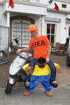 Eindhoven, 18 Juni 2010
Johan Vlemmix op zijn scooter in het Fifa shirt en Africa mascotte ( die inmiddels niet meer verkocht mag worden in Nederland ).
Foto Peter Smulders BV