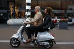 Amsterdam 16 juni 2017
Astrid Joosten achter op de vespa scooter bij Maik de Boer