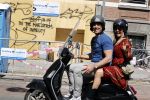 Amsterdam 9  mei 2020
Patrick Singels met zijn vrouw Corine op de scooter.