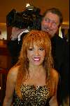 Amsterdam 16 maart 2003
modeshow paul schulten in okura
patricia Paay met cameraman paolo de graaf