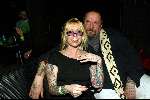 Amsterdam 3 maart 2004
Presentatie nieuw magazine Jacky in Jimmy Woo.
Henk Schiffmacher met vrouw en tatoeage