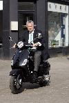 Amsterdam 24 maart 2005
Bram Moszkowicz op nieuwe Vespa scooter.