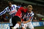 Eindhoven, 4 maart 2006 Kompetitiewedstrijd PSV-SC Heerenveen, eindstand 4-1 Seizoen 2005/2006
Jefferson Farfan in de tang bij Thomas Prager en Fernando Derveld