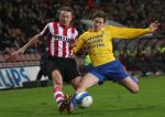 Eindhoven, 3 Maart 2007 Kompetitiewedstrijd PSV-RKC eindstand 2-0 Seizoen 2006/2007
Jan Kromkamp in duel met Ruud Berger