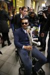Schiphol 17 maart 2013
Badr Hari en Estelle Cruijff  komen terug van de K1 finale in Zagreb waar Badr zijn voet gebroken heeft . Badr wordt in een rolstoel naar zijn auto gebracht.
Peter Smulders bv