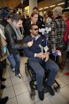 Schiphol 17 maart 2013
Badr Hari en Estelle Cruijff  komen terug van de K1 finale in Zagreb waar Badr zijn voet gebroken heeft . Badr wordt in een rolstoel naar zijn auto gebracht.
Peter Smulders bv