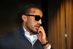 Schiphol 17 maart 2013
Badr Hari en Estelle Cruijff  komen terug van de K1 finale in Zagreb waar Badr zijn voet gebroken heeft . Badr wordt in een rolstoel naar zijn auto gebracht.
Peter Smulders bv