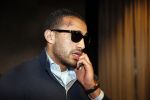 Schiphol 17 maart 2013
Badr Hari en Estelle Cruijff  komen terug van de K1 finale in Zagreb waar Badr zijn voet gebroken heeft . Badr wordt in een rolstoel naar zijn auto gebracht.
Peter Smulders bv