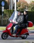 Amsterdam 8 maart 2016
Martijn Krabbe met zijn vriendin Noi Pakon op zijn vespa scooter.