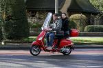 Amsterdam 8 maart 2016
Martijn Krabbe met zijn vriendin Noi Pakon op zijn vespa scooter.