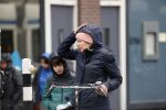 Amsterdam 2 maart 2020
Tjitske Reidinga met zoon in de regen op de fiets.