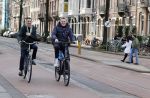 Amsterdam 20 februari 2021
Erwin Olaf met partner  op de fiets in Amsterdam zuid.