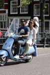 Amstedam 25 april 2007
Patrick Kluivert met fuck the paparazzi t shirt en zijn zwangere vriendin Rossana Lima op vespa scooter door amsterdam.