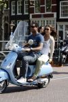 Amstedam 25 april 2007
Patrick Kluivert met fuck the paparazzi t shirt en zijn zwangere vriendin Rossana Lima op vespa scooter door amsterdam.