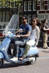 Amstedam 25 april 2007
Patrick Kluivert met fuck the paparazzi t shirt en zijn zwangere vriendin Rossana Lima op vespa scooter door amsterdam.