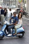 Amstedam 25 april 2007
Patrick Kluivert met fuck the paparazzi t shirt en zijn zwangere vriendin Rossana Lima op vespa scooter door amsterdam.