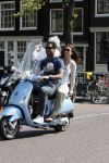 Amstedam 25 april 2007
Patrick Kluivert met fuck the paparazzi t shirt en zijn zwangere vriendin Rossana Lima op vespa scooter door amsterdam.