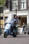 Amstedam 25 april 2007
Patrick Kluivert met fuck the paparazzi t shirt en zijn zwangere vriendin Rossana Lima op vespa scooter door amsterdam.