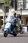Amstedam 25 april 2007
Patrick Kluivert met fuck the paparazzi t shirt en zijn zwangere vriendin Rossana Lima op vespa scooter door amsterdam.