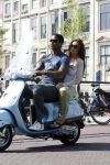 Amstedam 25 april 2007
Patrick Kluivert met fuck the paparazzi t shirt en zijn zwangere vriendin Rossana Lima op vespa scooter door amsterdam.